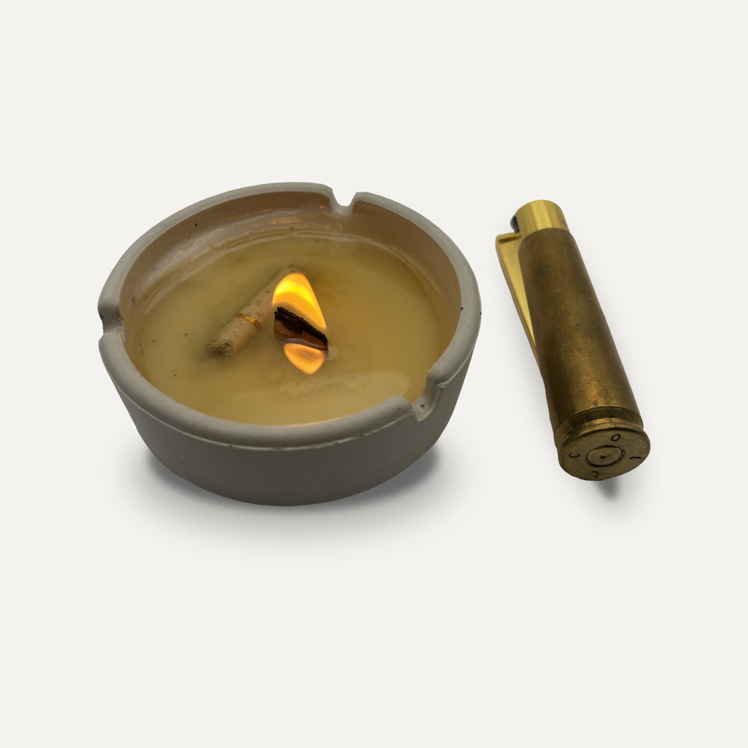 ASHTRAY_CANDLE, lit, with a brass lighter